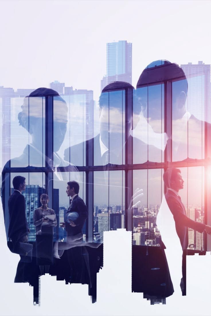 Business professionals reflected against a city office skyline
